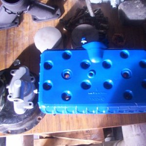 Rotax_532_head_water_pump_cover_water_outlet_pistons_jpg