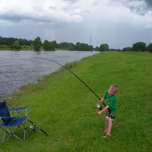 fighting his first catfish