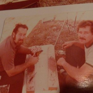 my dad on the left and his budy will on the right cleaning frogs