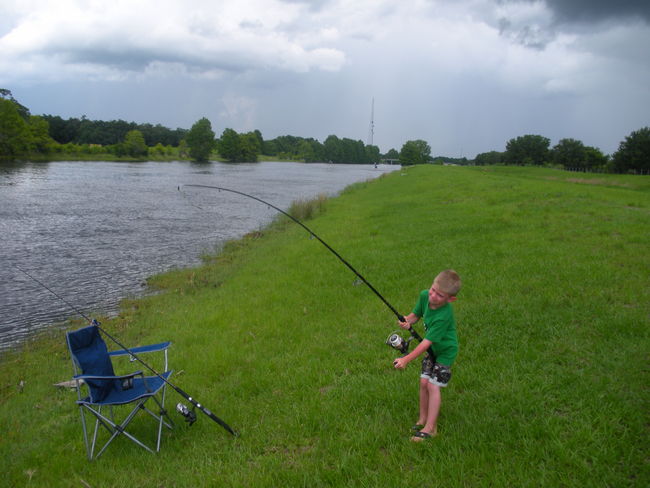 fighting his first catfish