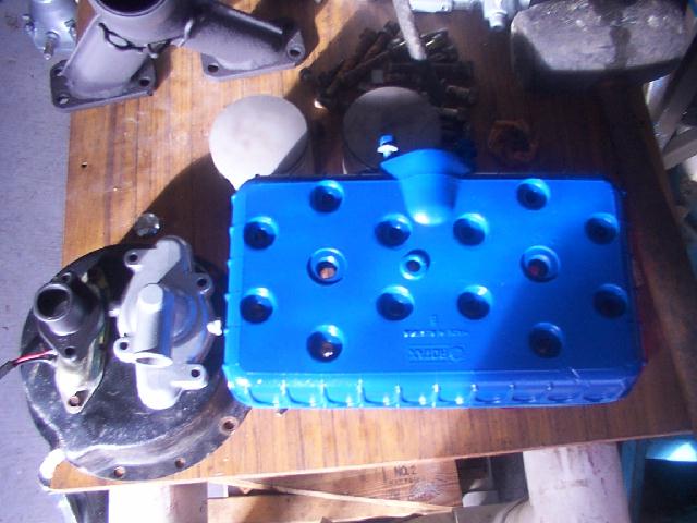 Rotax_532_head_water_pump_cover_water_outlet_pistons_jpg